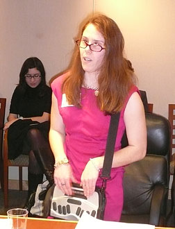 Chelsea Cook reads from her notetaker.