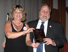Janet Campbell, general manager, Audio-Reader/KPR,�presents the 2010 C. Stanley Potter Lifetime Achievement Award to David Andrews.