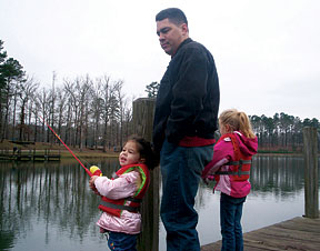 Eddie Bell and his girls go fishing.