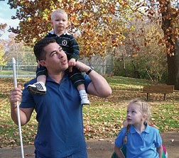 Eddie Bell in the park with children