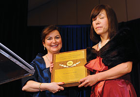 SWE president Siddika Demir presents a plaque to Chieko Asakawa.