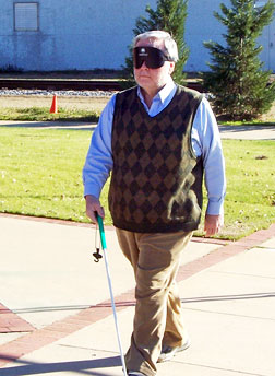 Father Sheehan sets out for a travel lesson under sleepshades.