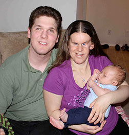 Husband Mike and C.J. Fish are shown here with Gabriel Andrew.