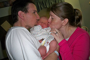 Jesse and Mary Jo Hartle admire their new baby, Kayla Elizabeth