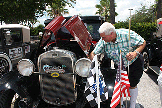 An auto show of antique and special interest vehicles was held on Monday afternoon. Here Stanley Nowacyzk examines a Model A Ford.