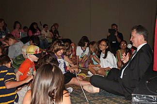 President Maurer settles down to a discussion with young convention attendees.