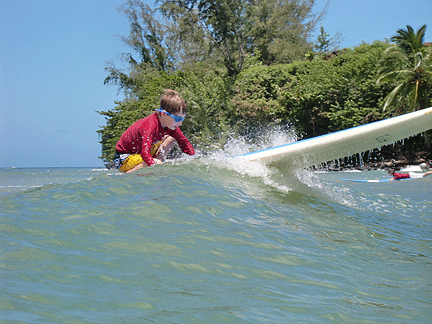 Petras stoops down on his board at the end of another successful ride.