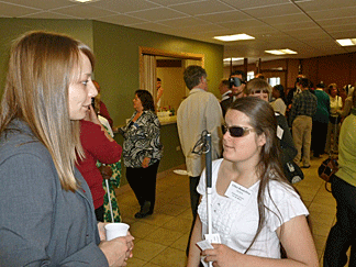 Student Liliya Asadullina speaks to a local businessperson about her goals after graduation. Photo by Stacey Johnson, CCB