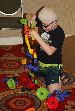Drake Alberhasky constructs a tower in NFB Camp.