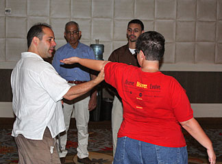 An instructor and a student work on the art of self defense.