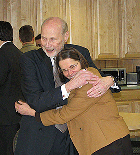 Mary Ellen Jernigan hugs Jim Omvig at his birthday celebration at the Center.
