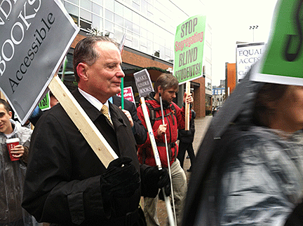 Marc Maurer leads people of all ages to demonstrate for the right of K-12 students to be literate and to read alongside their sighted classmates.