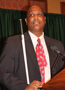 Anil Lewis speaking at the 2013 convention