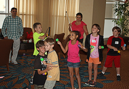 Kids playing with maracas
