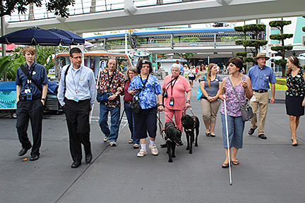 The group walks from Tomorrowland towards Fantasyland