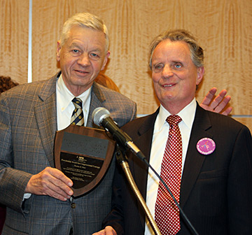Congressman Tom Petri receives the National Federation of the Blind Presidential Award for Congressional Courage from President Maurer.