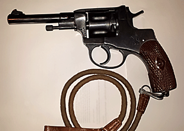 This unusual handgun was used extensively by the Russian military during World Wars I and II. The revolver’s most distinctive feature is the seven-shot cylinder. The flutes between each chamber do not extend to the end of the cylinder, but are instead hollowed out depressions in the middle of the cylinder. The cylinder also moves forward when the gun is cocked, sealing the gap between the cylinder and the barrel. This keeps high-pressure gases from escaping, and increases the velocity of the fired bullet. The unique design of the cylinder contributes to the strange overall appearance of the revolver.