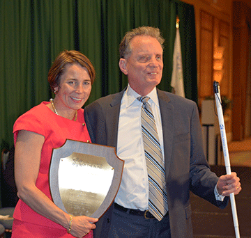 Maura Healey poses with plaque and Marc Maurer