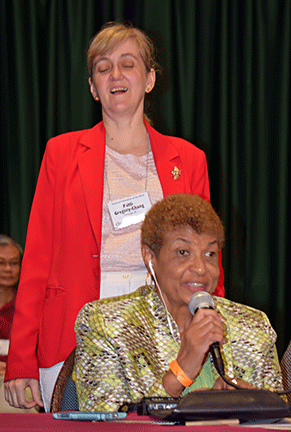 Patti Chang stands behind her co-chair of the host committee, Ever Lee Hairston.