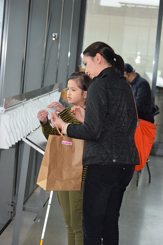 Andrea Cataquiz and her mother Cecile explore the tide exhibit.