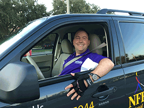 Mark Riccobono sits in the Blind Driver Challenge vehicle, ready to take WBU delegates for a quick spin.