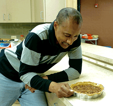 Warren leans in to savor the smell of Pikes Peak Pecan Pie.