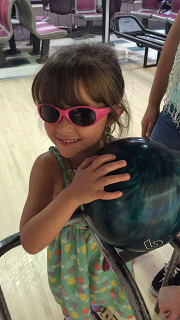 Kyleigh holds a bowling ball, ready to roll in Lincolnton, North Carolina.