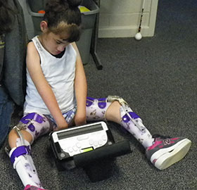 Taylin uses a Braille Sense at the BELL Academy in Columbia, South Carolina.
