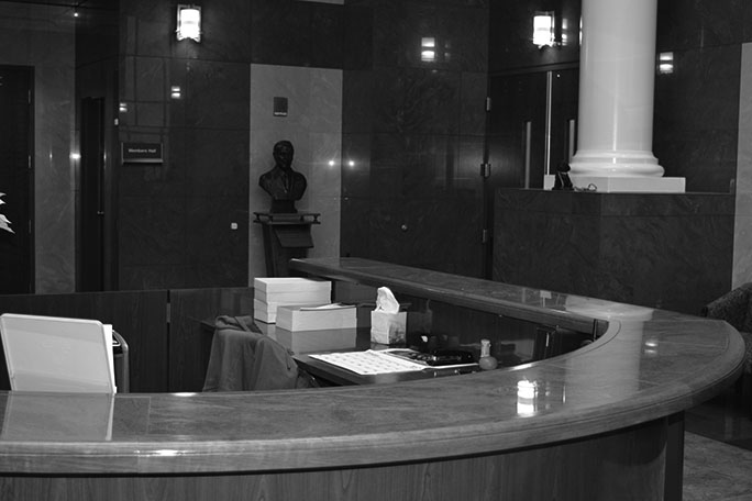 A view of the desk in the atrium as seen by visitors arriving on the elevators. A bust of Kenneth Jernigan is visible against the far wall.