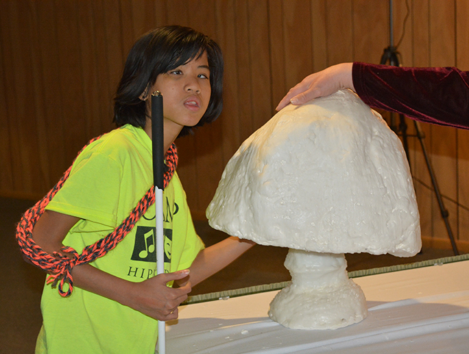 Virginia Jacobs gets a feel for the large mushroom-shaped White Sculpture.
