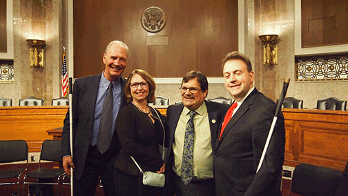 Jim and Susan Gashel, Congressman Gus Bilirakis, and Mark Riccobono pose together.