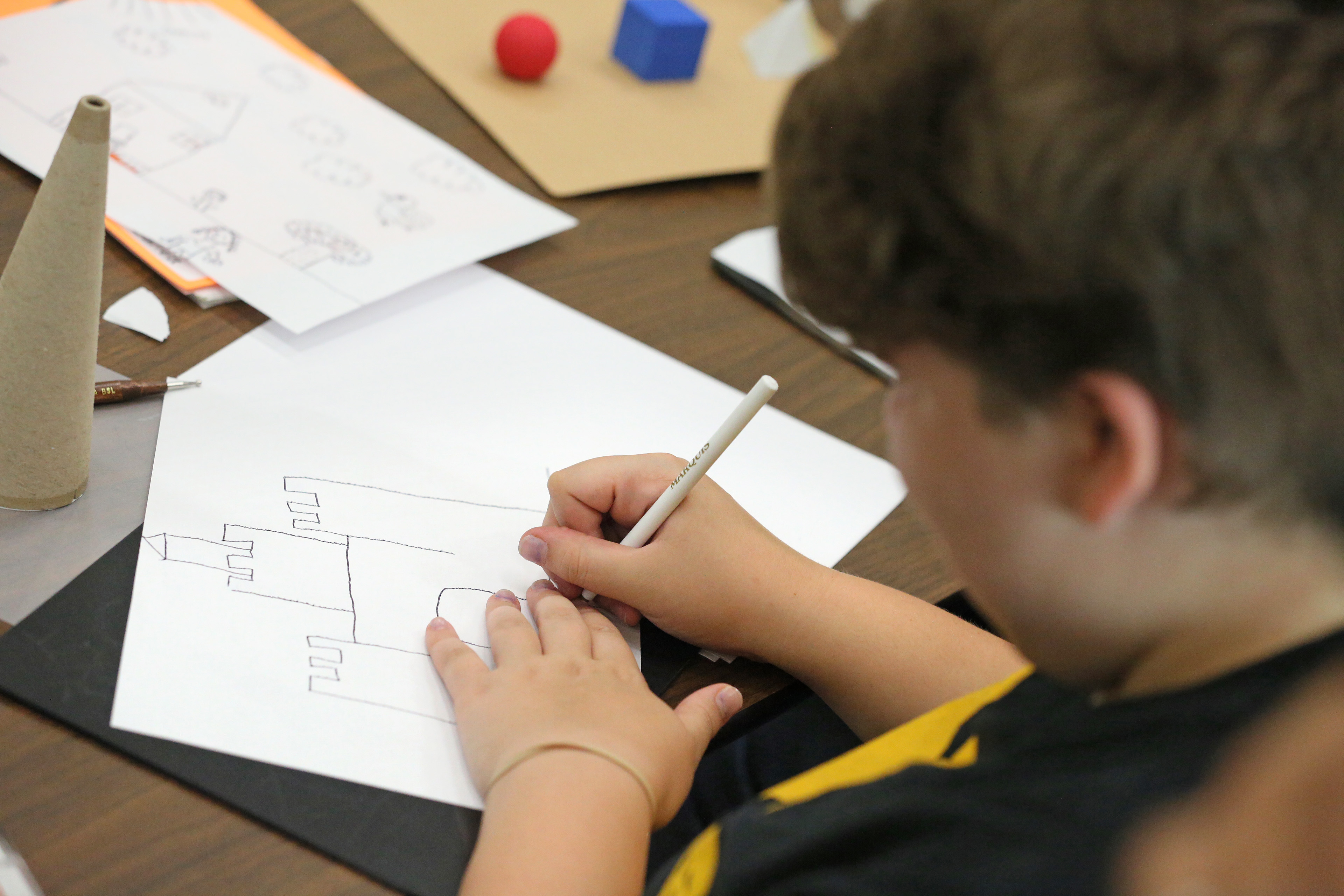 Chasity works on drawing her house&rsquo;s design