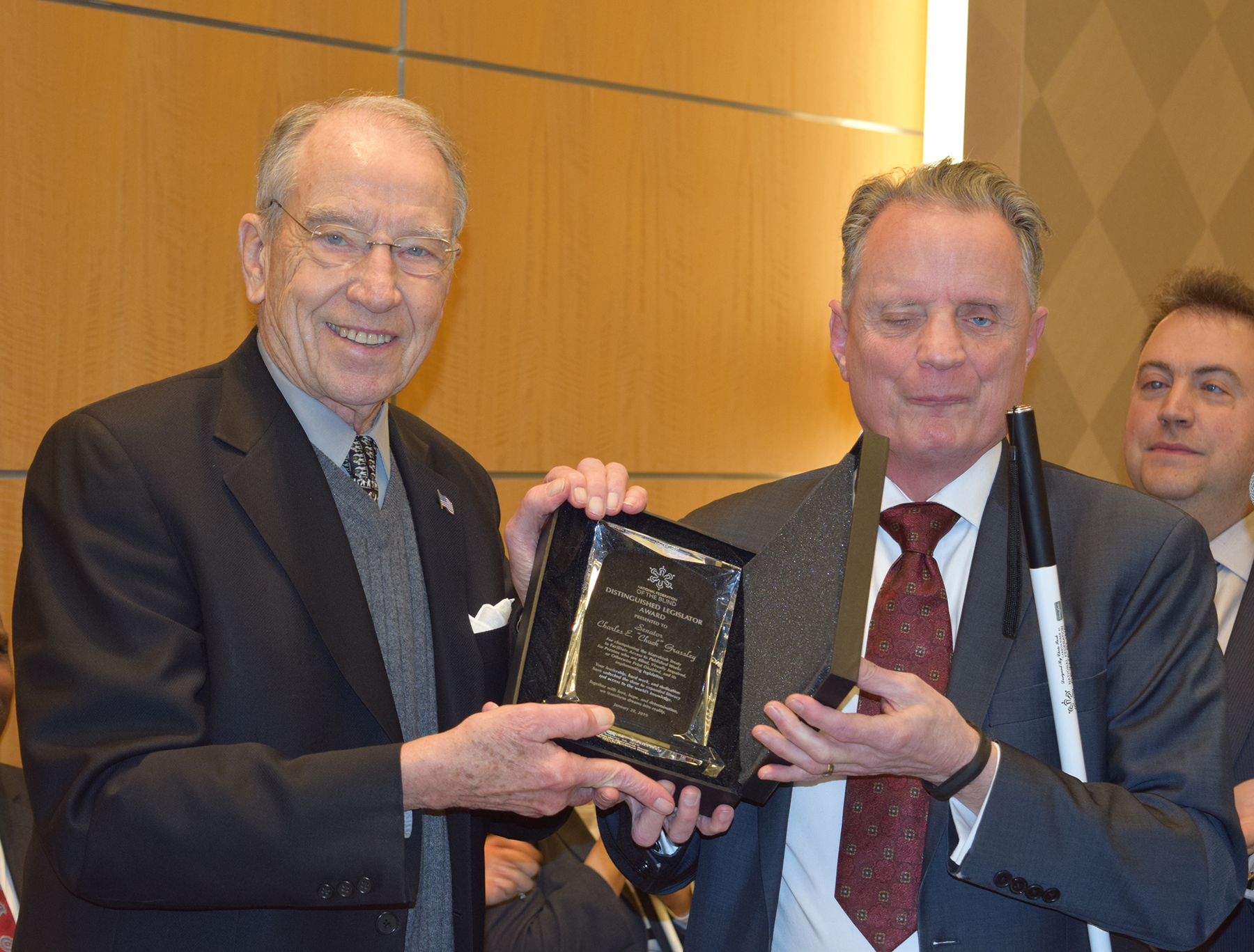 Senator Grassley poses with Dr. Marc Maurer while holding the Distinguished Legislator Award
