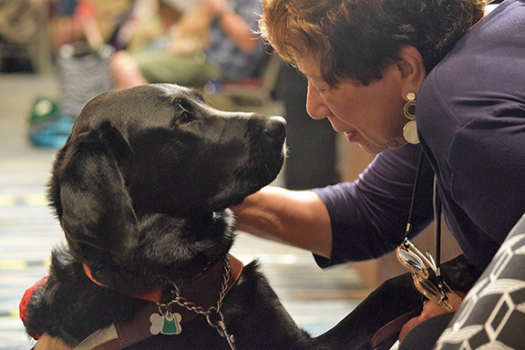 Nani Fife loves on her guide dog
