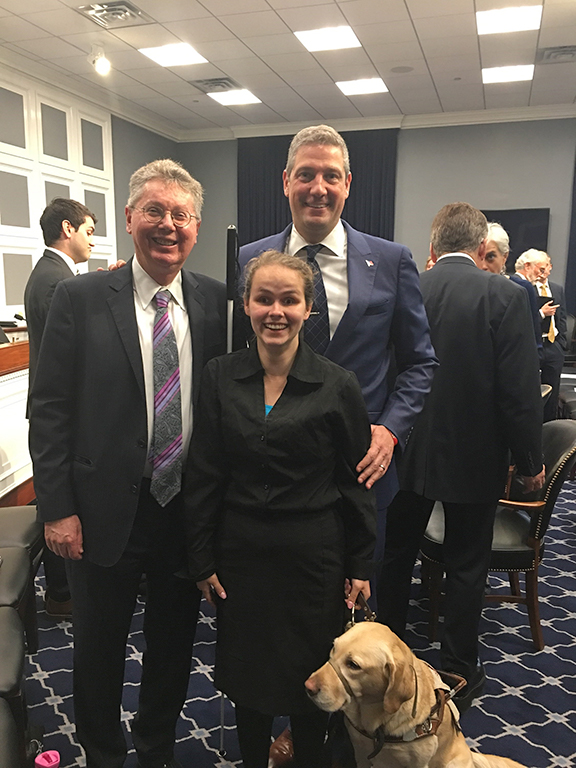Stephanie Flint and her guide dog at Capitol Hill with John Paré and Ohio Congressman Tim Ryan regarding new funding for the National Library Service for the Blind