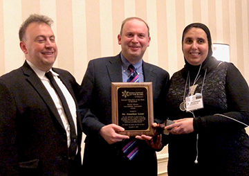 Dr. Lazar accepts the Rachel Olivero Accessibility Innovation Award.