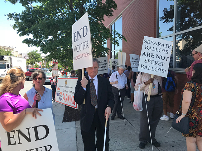 Immediate Past President Maurer participates in a protest of inaccessible voting procedures in Maryland.