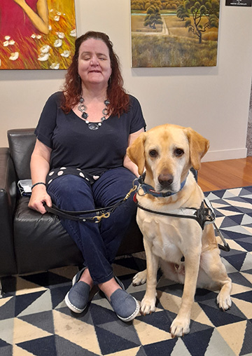 Martine Abel-Williamson with her guide dog.