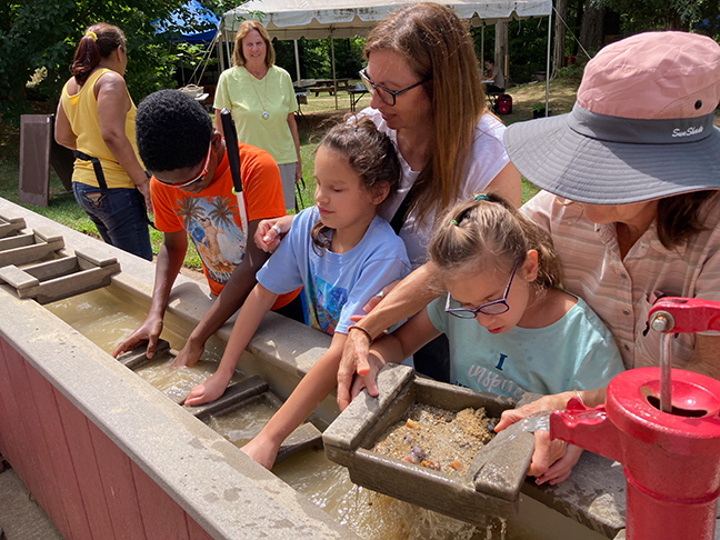 In Connecticut, BELL students try their hands at “gold” mining during a visit to the Dinosaur Park.