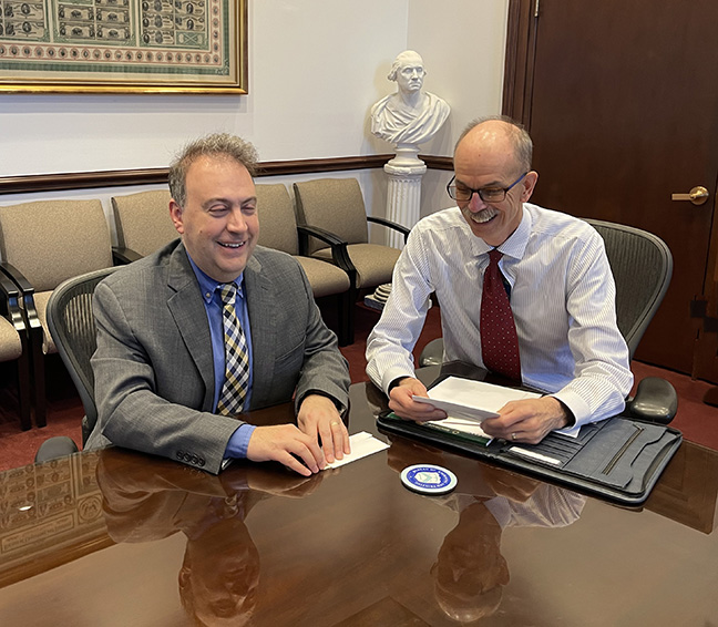 President Riccobono and Len Olijar examine the raised tactile features on the next generation $10 bill.