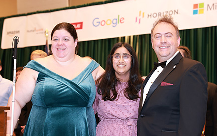 Cayte Mendez, Trisha Kulkarni, and Mark Riccobono smile and pose for a picture.