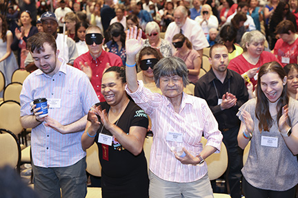 NFB Members clap and cheer during opening general session performances.
