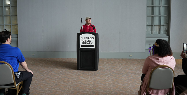 Mark Riccobono addresses the crowd at the Ride for Literacy finale at the Chicago Public Library.