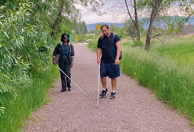 There are few if any sidewalks, especially in Liberian villages, let alone paved roads. ITP student Noah B. walks with Miatta on the bike path near the Center, just for the experience of something other than concrete and asphalt.