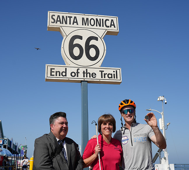 Dan O&rsquo;Rourke with Pam Allen and Robert Stigle at the Santa Monica Route 66 End of the Trail sign.