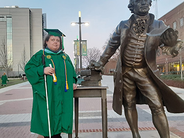 Marinela Ortiz in her cap and gown at her George Mason University graduation.
