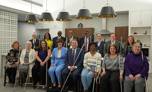 The NFB Board of Directors. Left to Right, back row: Adelmo Vigil, Marilyn Green, Ron Brown, Shawn Callaway, Donald Porterfield, Tracy Soforenko, Everette Bacon, Carla McQuillan. Front row: Shelia Wright, Norma Crosby, Jessica Beecham, Pam Allen, Mark Riccobono, Barbara Manuel, Grace Pires, Marci Carpenter. (Tom Page not present.)