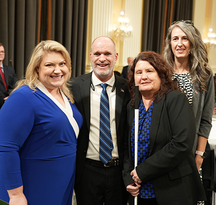 Representative Kat Cammack (R-FL) with Denise Valkema (front) and two other NFB members from Florida.