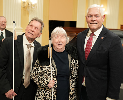 Representative Pete Sessions (R-TX) poses for a photo with Glenn and Norma Crosby.