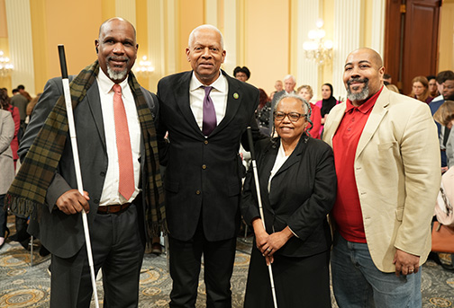 Anil Lewis, Representative Hank Johnson (D-GA), Dorothy Griffin, and Michael Armstrong pose for a photo.